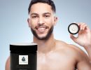 man holding moisturiser